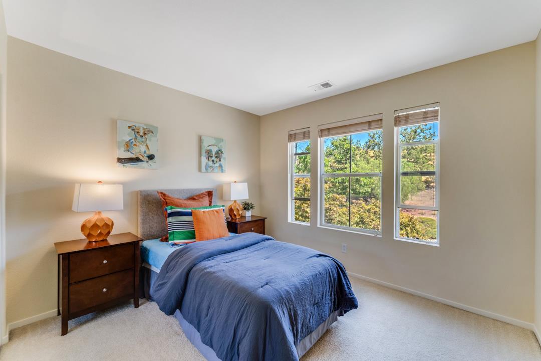 906 Schoolhouse Road San Jose, CA 95138 - Photo 25 of 57 a bedroom with a bed and window
