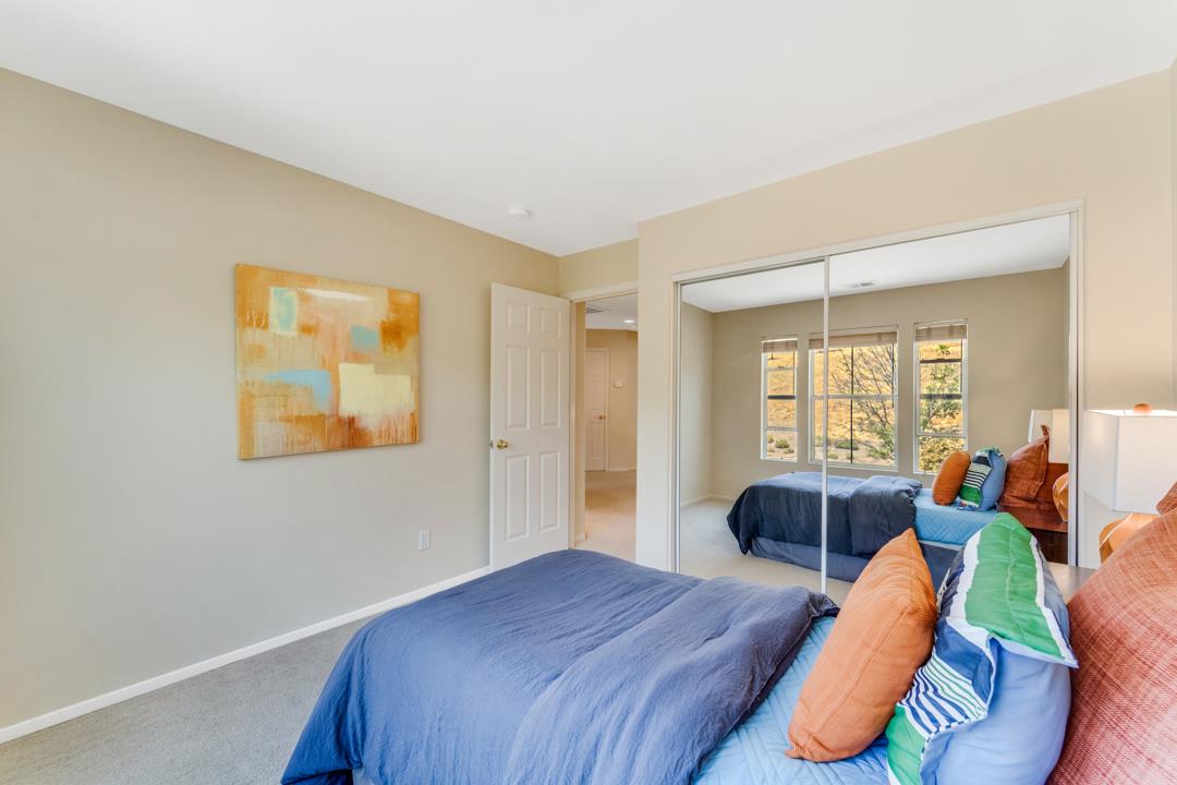 906 Schoolhouse Road San Jose, CA 95138 - Photo 26 of 57 a bedroom with a bed and wooden floor