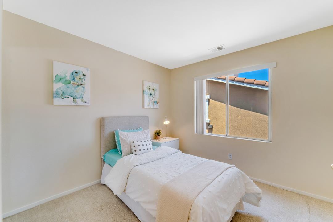 906 Schoolhouse Road San Jose, CA 95138 - Photo 27 of 57 a bedroom with a bed and a window