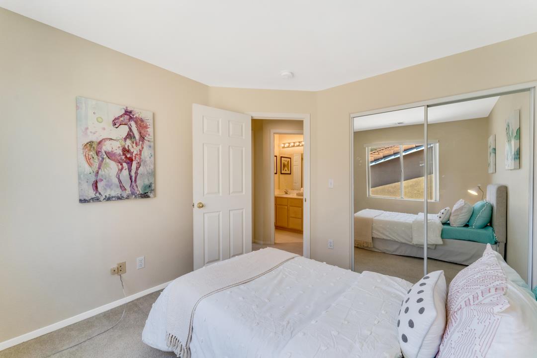 906 Schoolhouse Road San Jose, CA 95138 - Photo 28 of 57 a bedroom with a bed and a couch