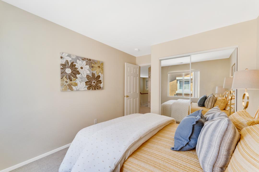 906 Schoolhouse Road San Jose, CA 95138 - Photo 30 of 57 a bedroom with a bed and a painting on the wall