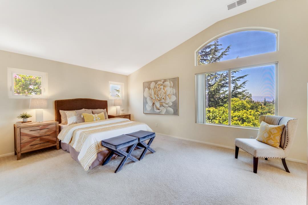 906 Schoolhouse Road San Jose, CA 95138 - Photo 31 of 57 a bedroom with a bed and a couch