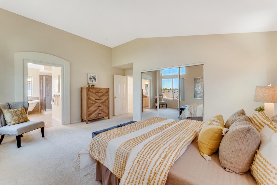 906 Schoolhouse Road San Jose, CA 95138 - Photo 32 of 57 a bedroom with a bed and a couch