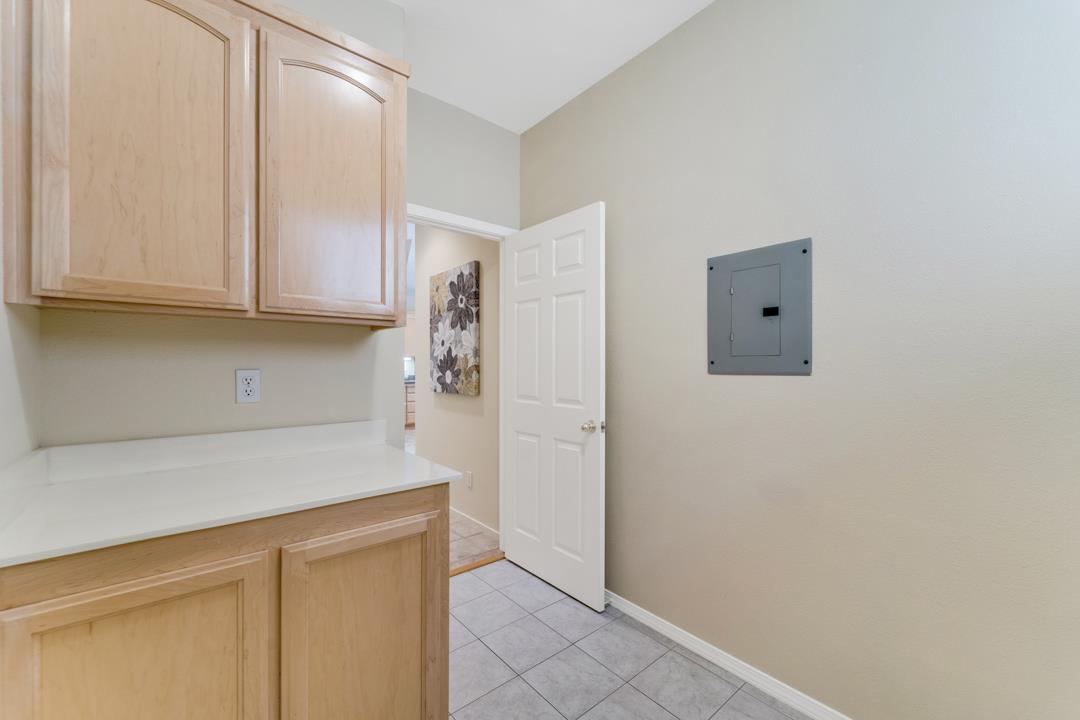 906 Schoolhouse Road San Jose, CA 95138 - Photo 36 of 57 a kitchen with stainless steel appliances a refrigerator and cabinets