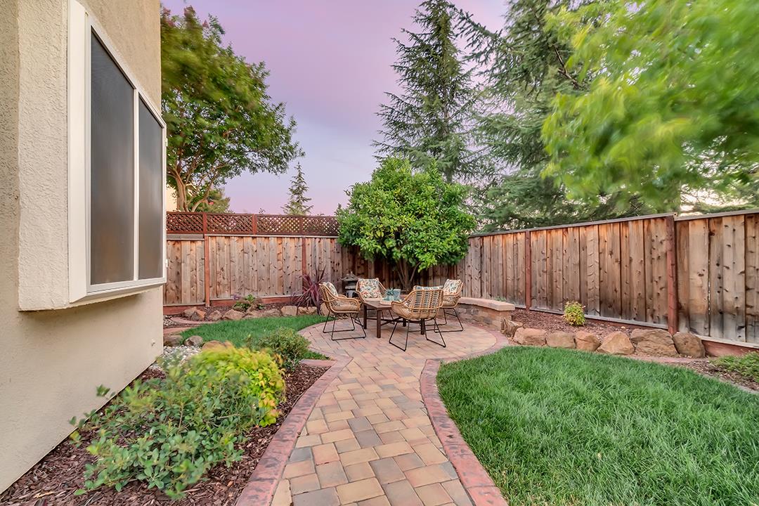 906 Schoolhouse Road San Jose, CA 95138 - Photo 43 of 57 a view of a chairs and table in backyard of the house