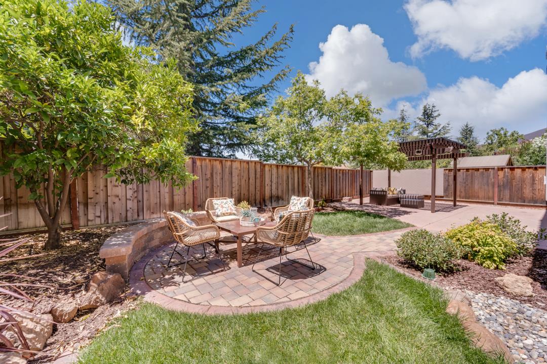906 Schoolhouse Road San Jose, CA 95138 - Photo 45 of 57 a backyard of a house with table and chairs
