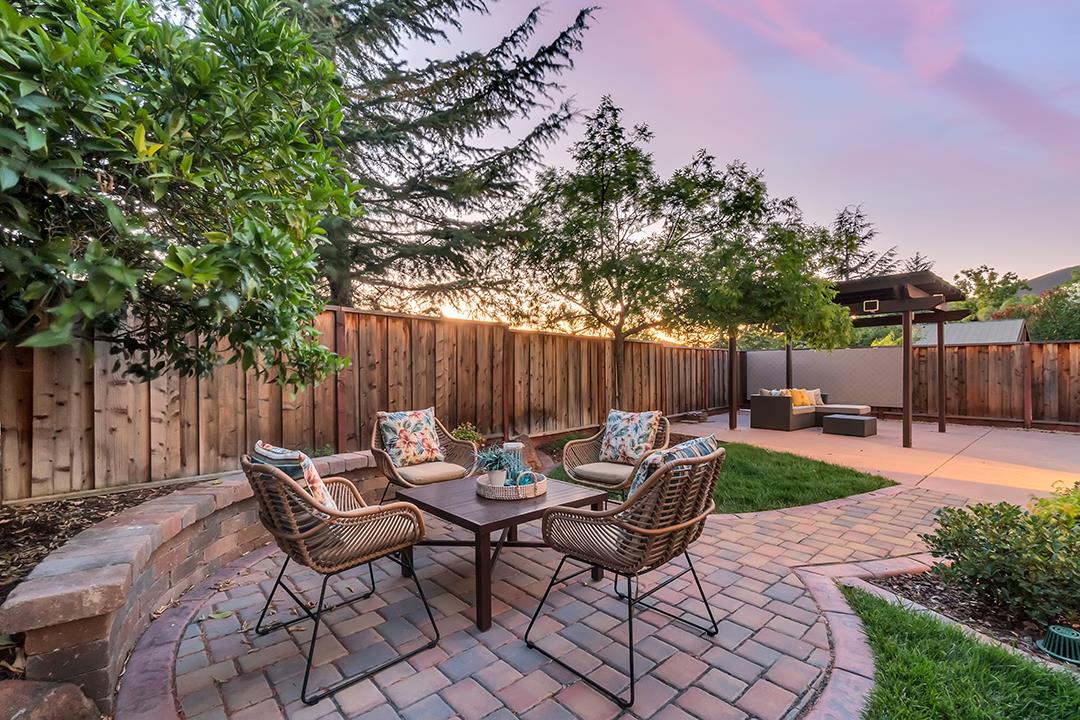 906 Schoolhouse Road San Jose, CA 95138 - Photo 48 of 57 a backyard of a house with table and chairs