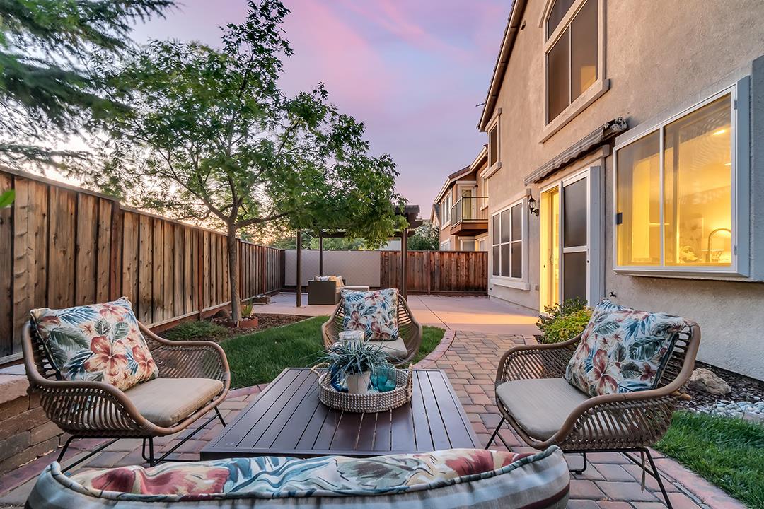 906 Schoolhouse Road San Jose, CA 95138 - Photo 49 of 57 a view of patio with couches table and chairs and potted plants