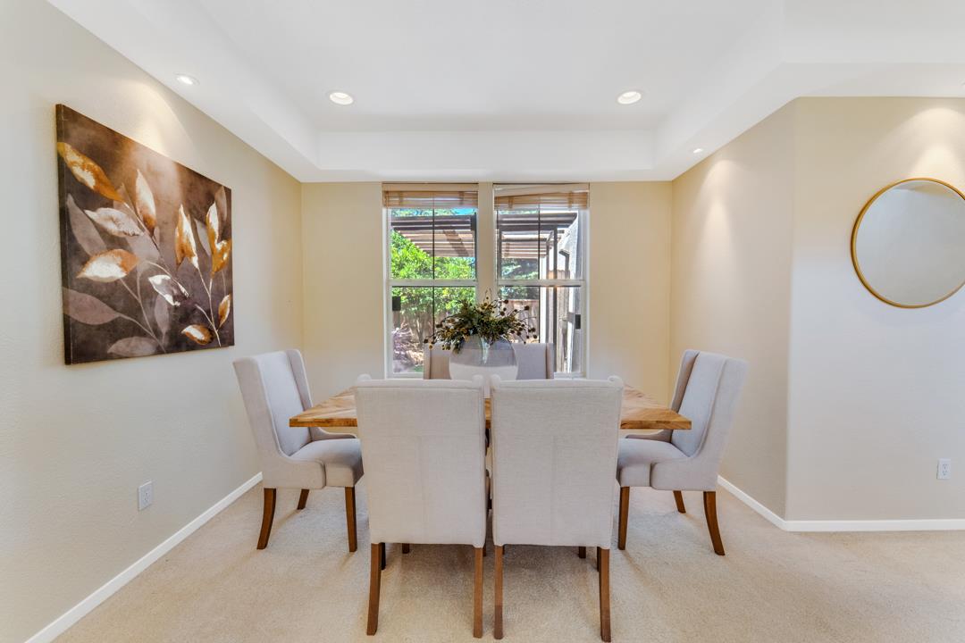 906 Schoolhouse Road San Jose, CA 95138 - Photo 7 of 57 a view of a dining room with furniture window and outside view