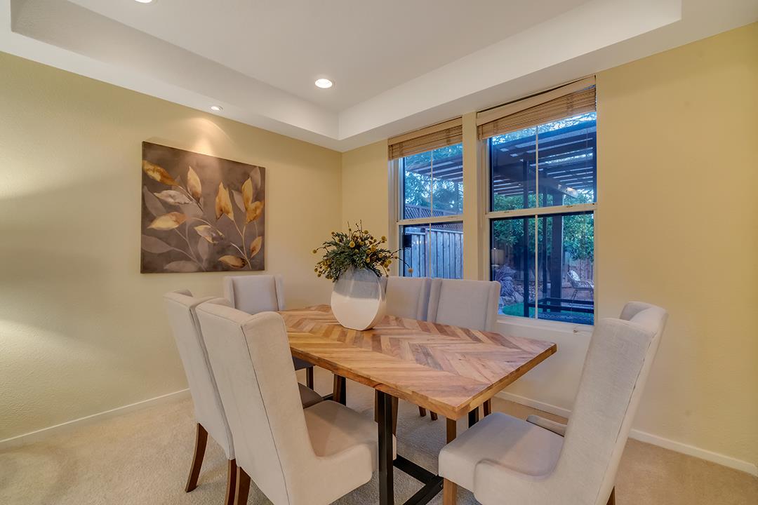 906 Schoolhouse Road San Jose, CA 95138 - Photo 8 of 57 a view of a dining room with furniture and window