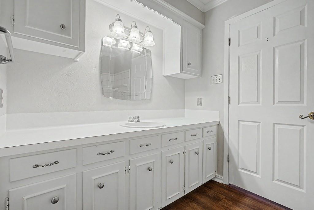 2104 Wainwright Court Longview, TX 75605 - Photo 15 of 31 a bathroom with a sink vanity and mirror