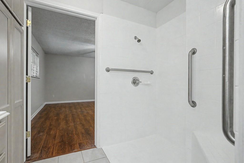 2104 Wainwright Court Longview, TX 75605 - Photo 16 of 31 a bathroom with a shower