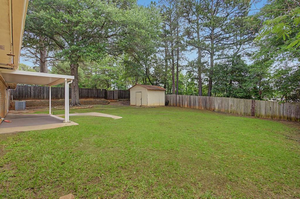 2104 Wainwright Court Longview, TX 75605 - Photo 20 of 31 front view of a house with yard
