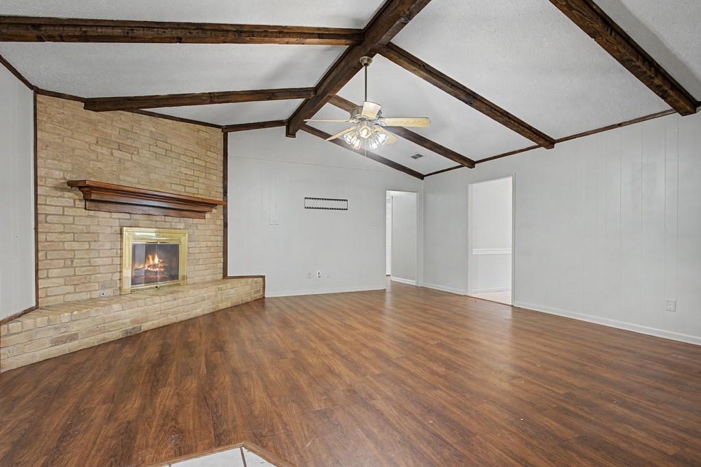 2104 Wainwright Court Longview, TX 75605 - Photo 22 of 31 a view of an empty room with wooden floor and a window
