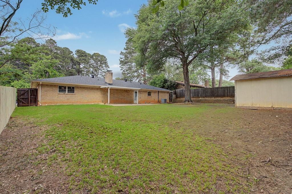 2104 Wainwright Court Longview, TX 75605 - Photo 24 of 31 front view of a house with a yard