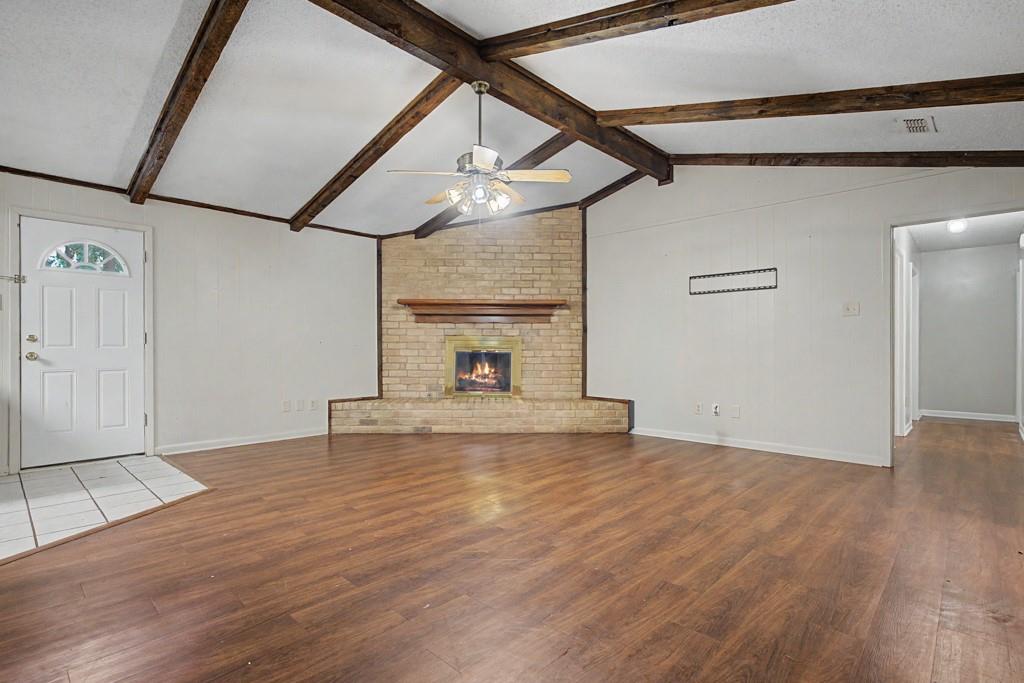 2104 Wainwright Court Longview, TX 75605 - Photo 27 of 31 a view of empty room with wooden floor and fireplace