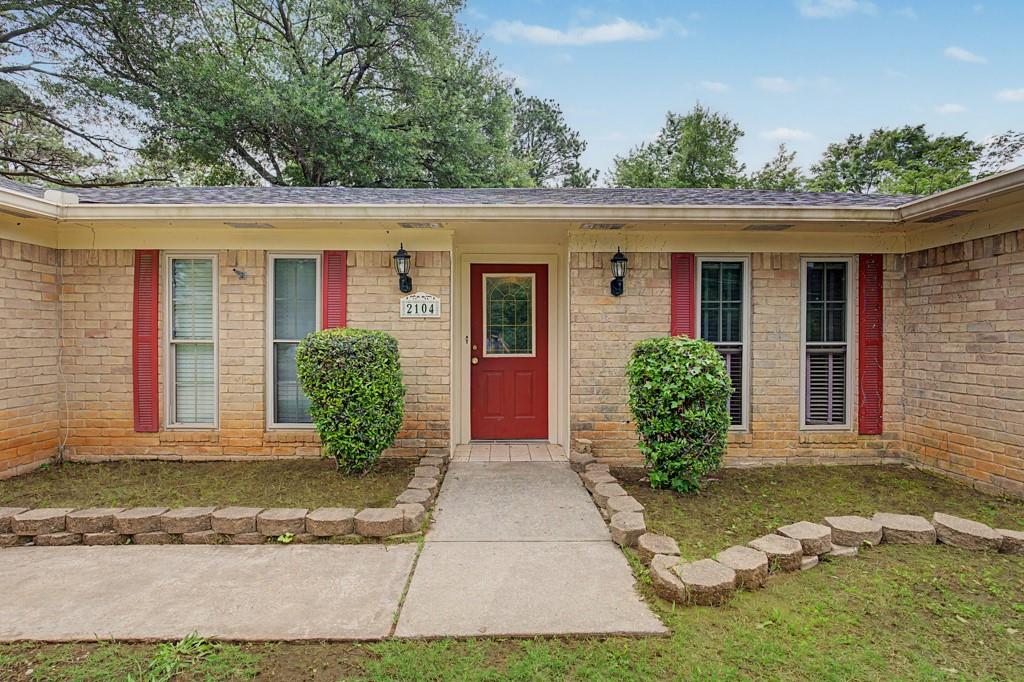 2104 Wainwright Court Longview, TX 75605 - Photo 28 of 31 a front view of a house with garden