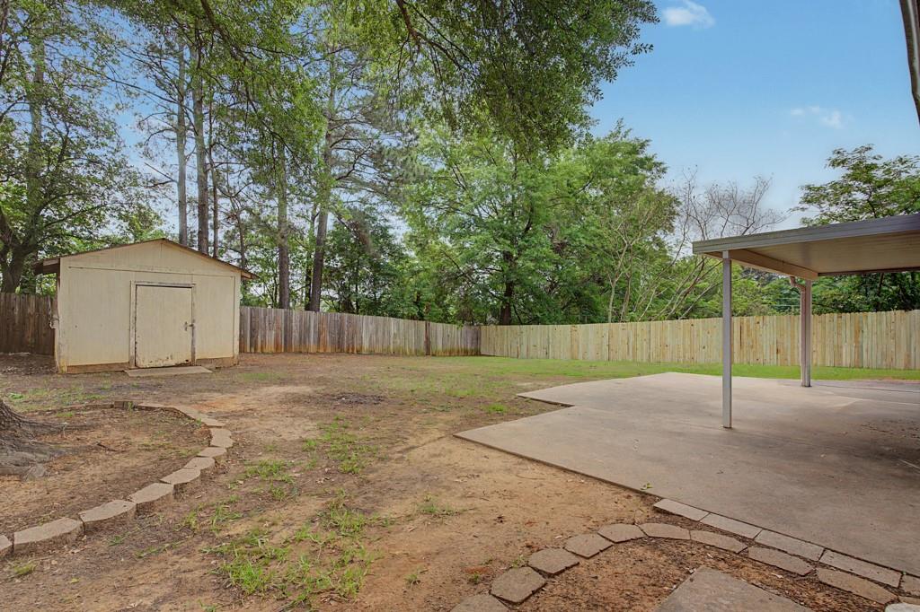 2104 Wainwright Court Longview, TX 75605 - Photo 30 of 31 a view of a backyard