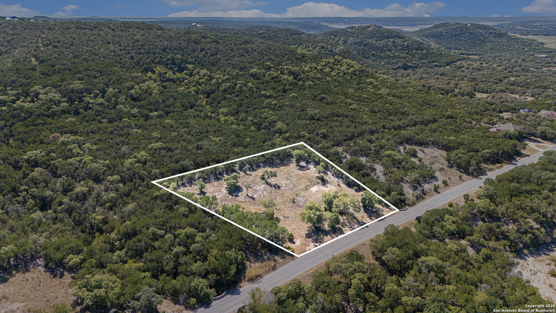 355 PR 1709 Mico, TX 78056 - Photo 1 of 18 an aerial view of a house with a yard