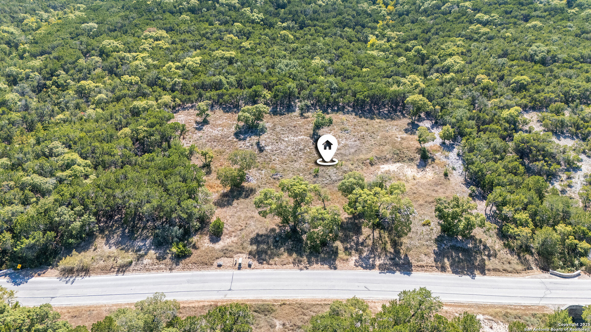 355 PR 1709 Mico, TX 78056 - Photo 12 of 18 an aerial view of a yard with mountain