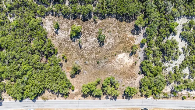 a view of a city with green field