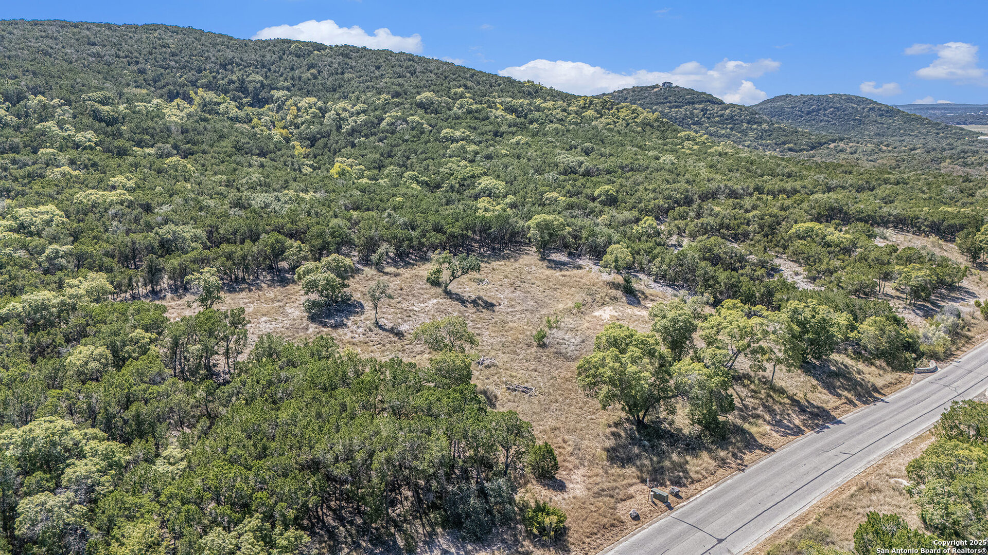 355 PR 1709 Mico, TX 78056 - Photo 4 of 18 a view of a mountain from a yard