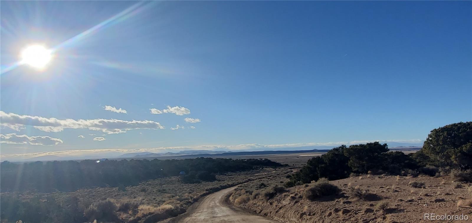 Lot 1057 Hotchkiss Road Fort Garland, CO 81133 - Photo 11 of 16 a view of a backyard of a house