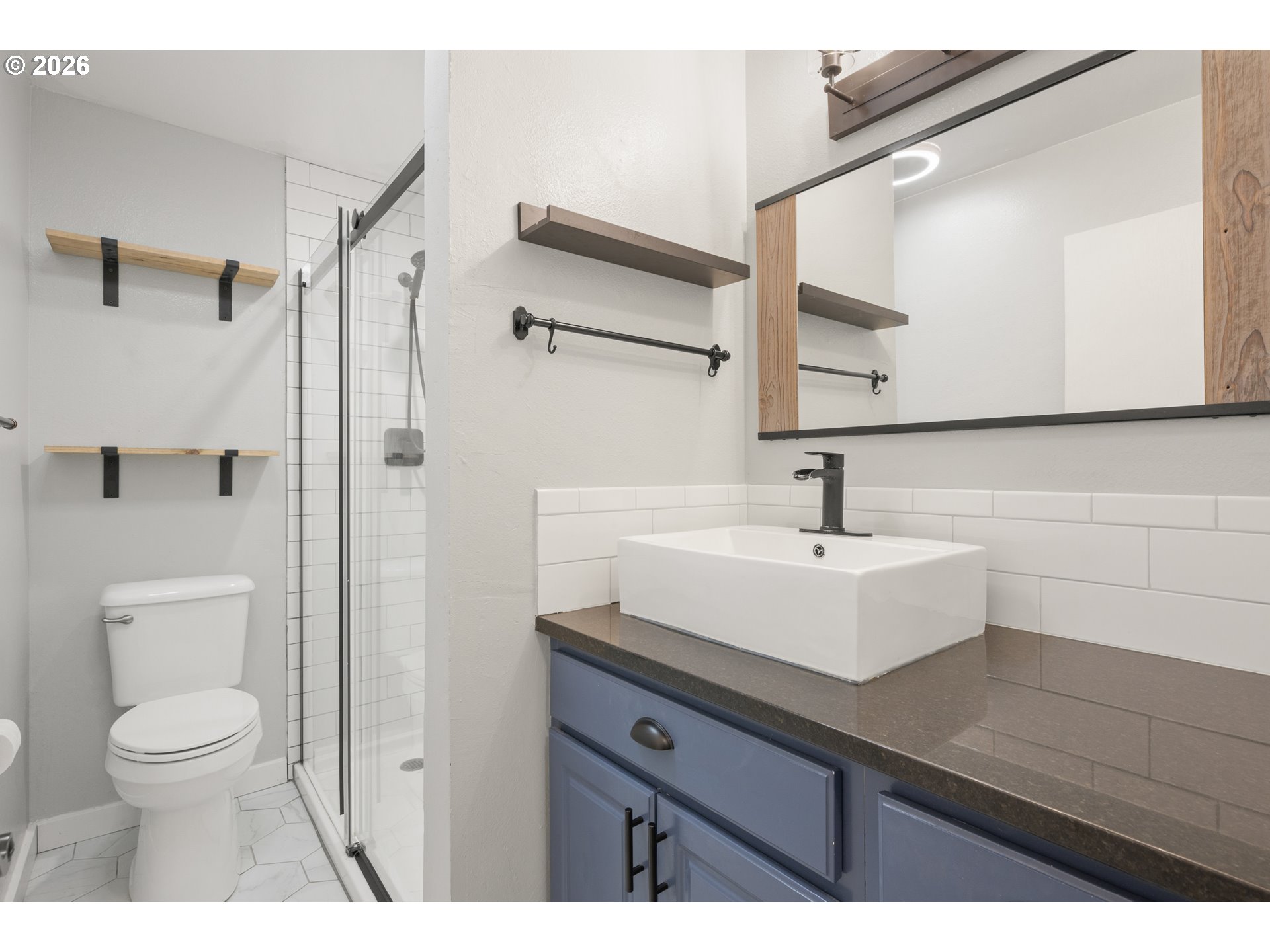 2727 Gateway Street, Unit 18 Springfield, OR 97477 - Photo 22 of 34 a bathroom with a sink a toilet and shower