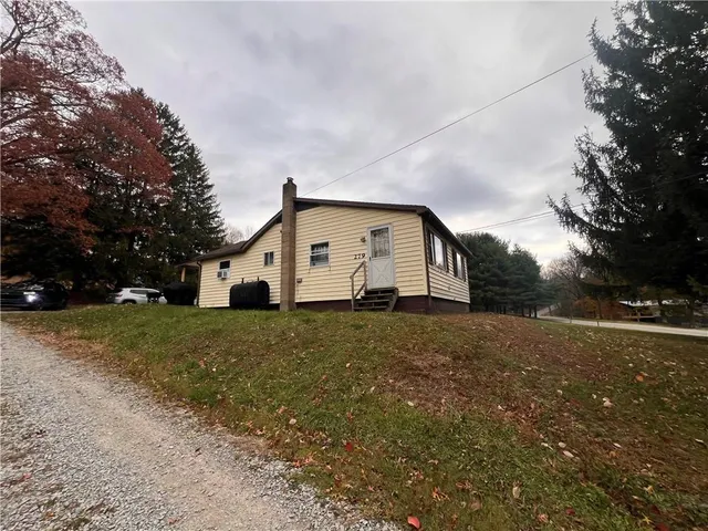a house view with a backyard space