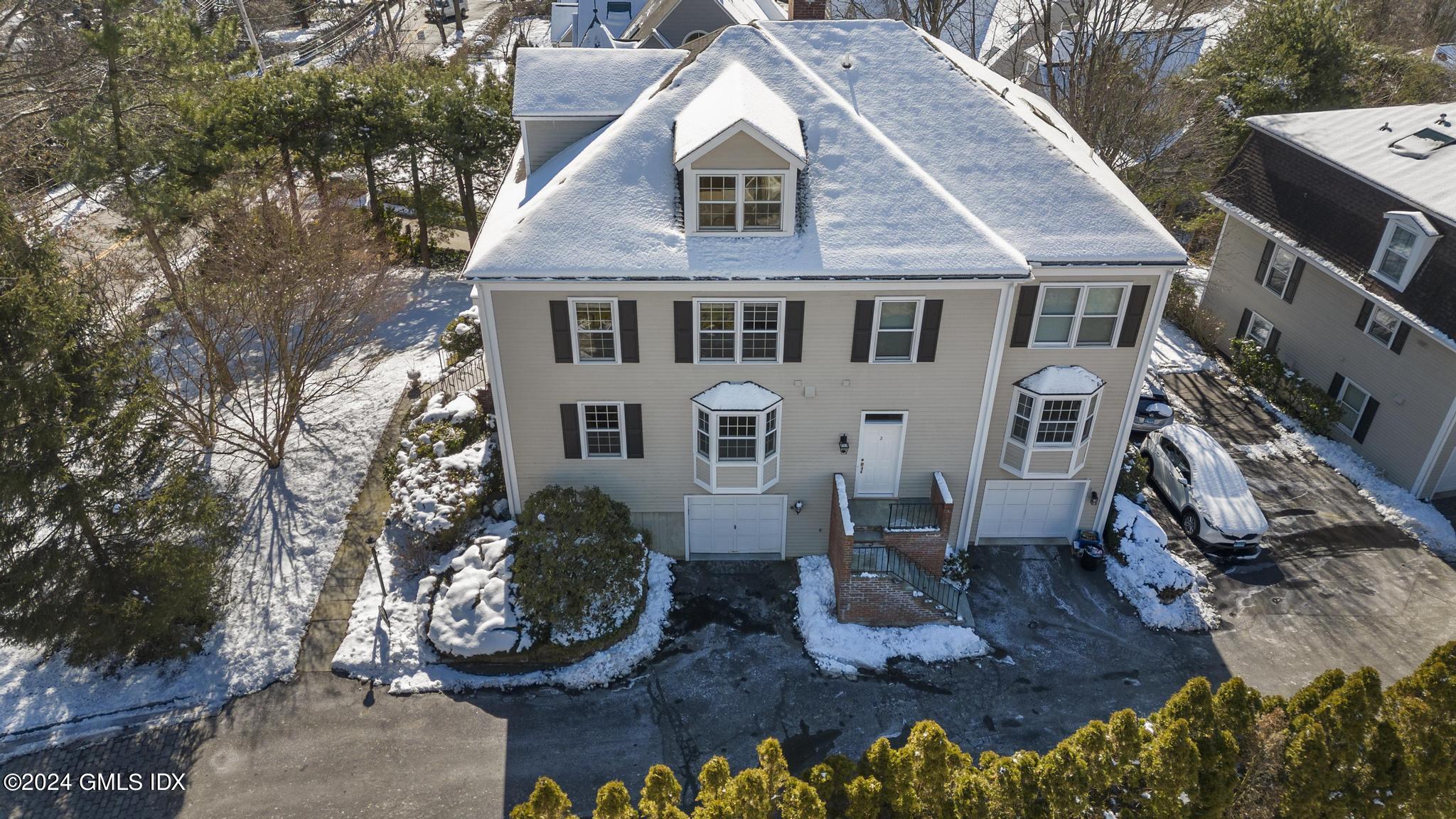 172 Field Point Road, Unit 1 Greenwich, CT 06830 - Photo 29 of 36 a aerial view of a house with a yard