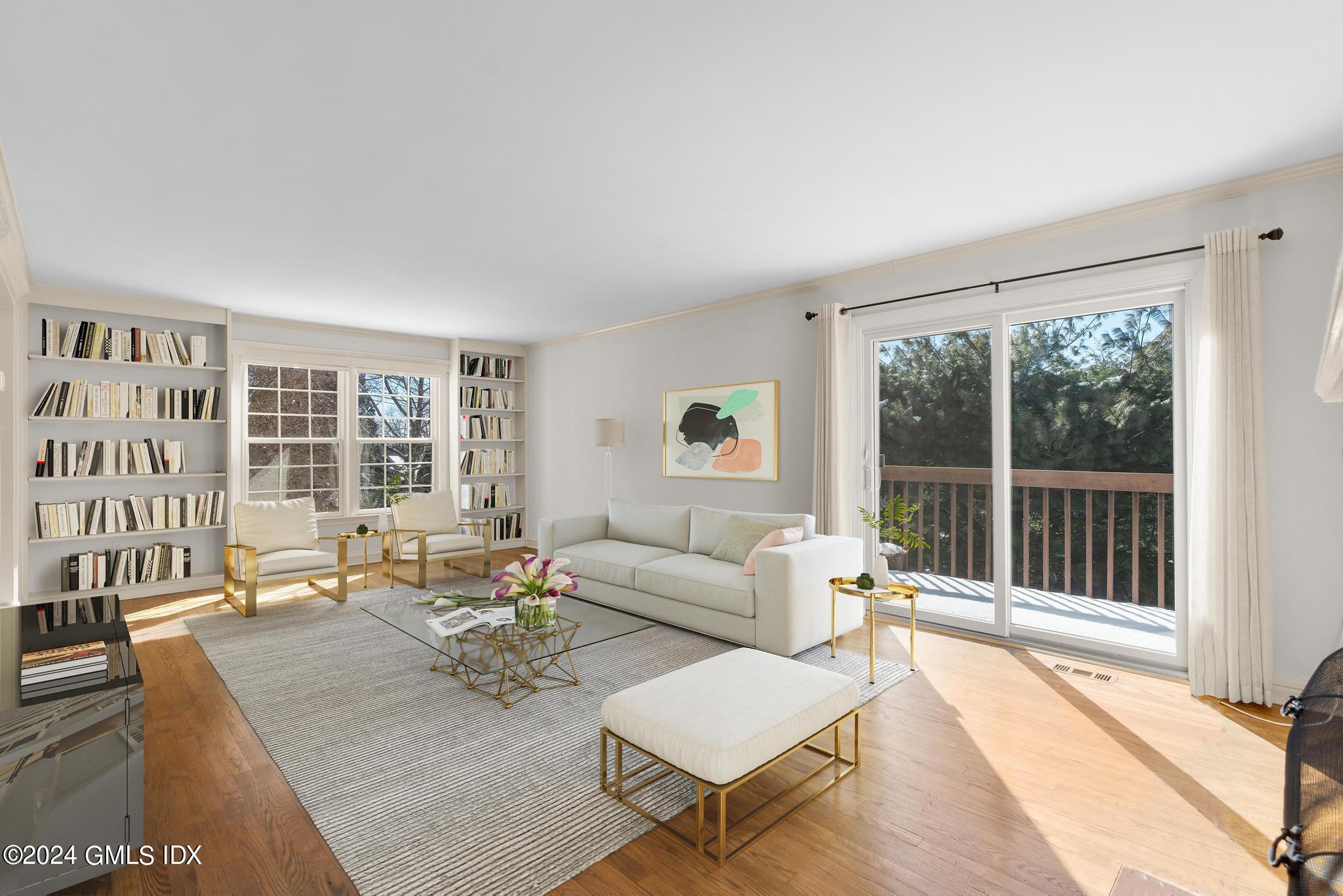 172 Field Point Road, Unit 1 Greenwich, CT 06830 - Photo 4 of 36 a living room with furniture and a large window