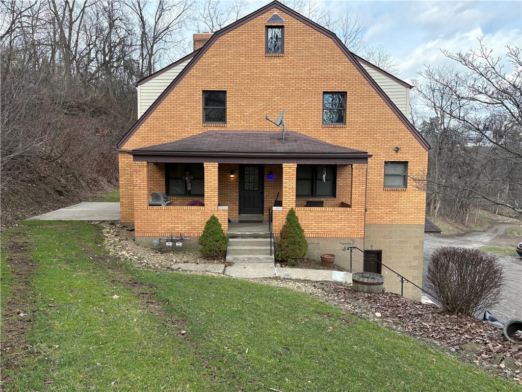 4465 Mt Troy Rd Extension, Unit 2 Pittsburgh, PA 15214 - Photo 1 of 36 a front view of a house with a yard