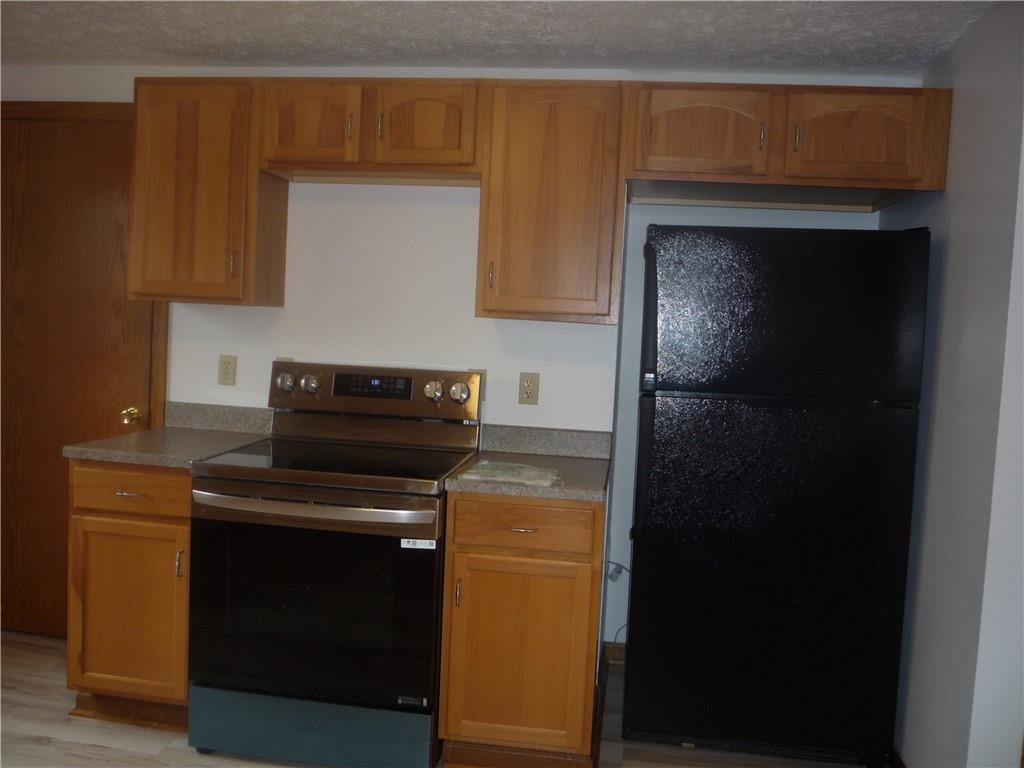 4465 Mt Troy Rd Extension, Unit 2 Pittsburgh, PA 15214 - Photo 11 of 36 a kitchen with a stove and a microwave