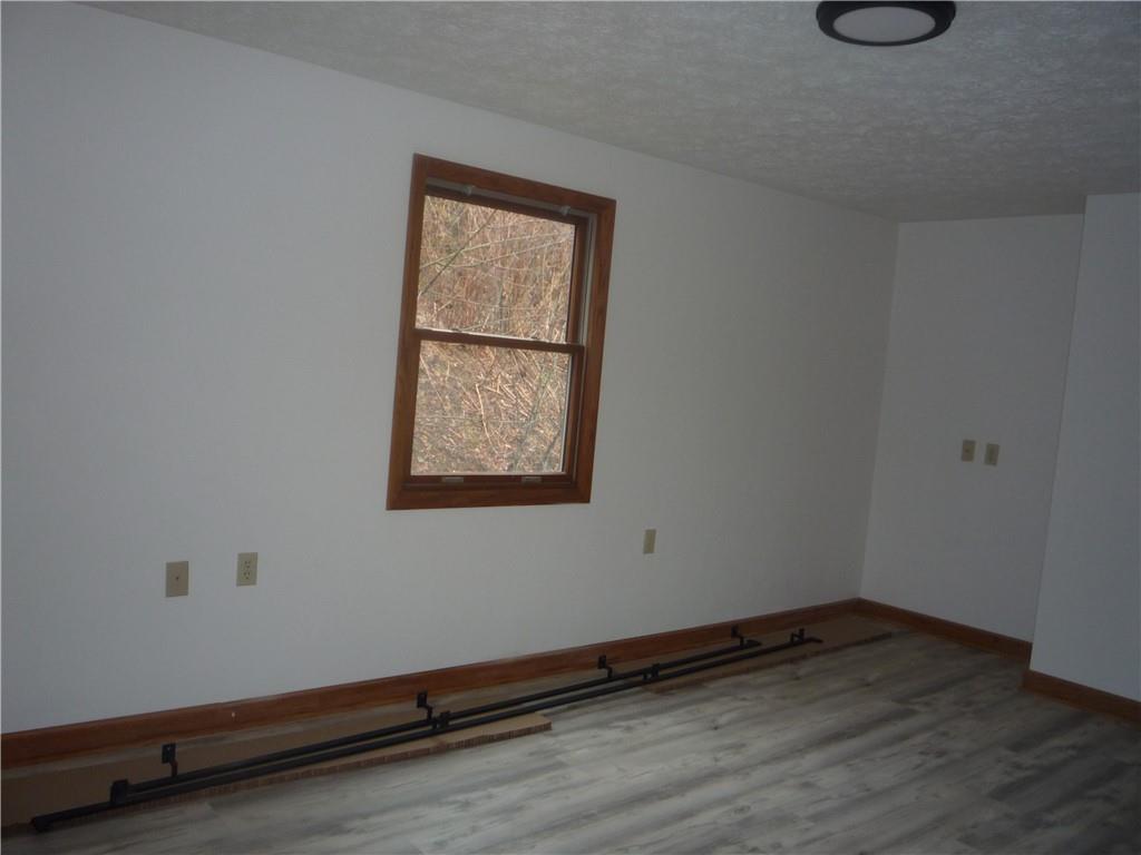 4465 Mt Troy Rd Extension, Unit 2 Pittsburgh, PA 15214 - Photo 19 of 36 a view of a room with wooden floor and window