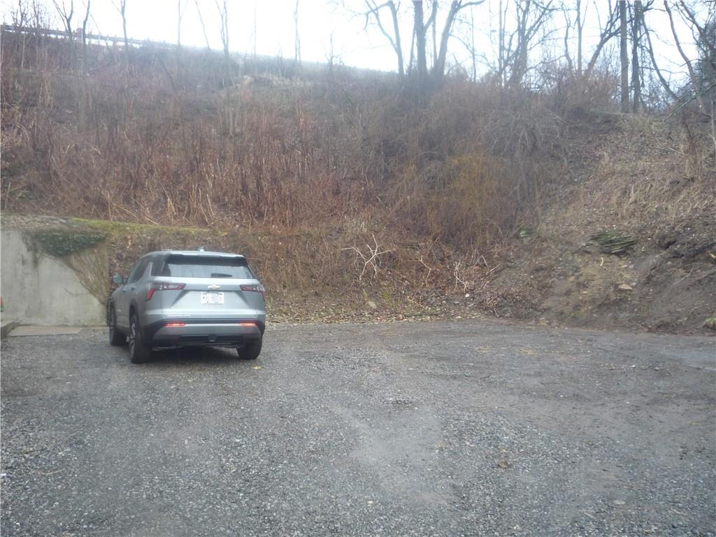 4465 Mt Troy Rd Extension, Unit 2 Pittsburgh, PA 15214 - Photo 35 of 36 a car parked in middle of a yard