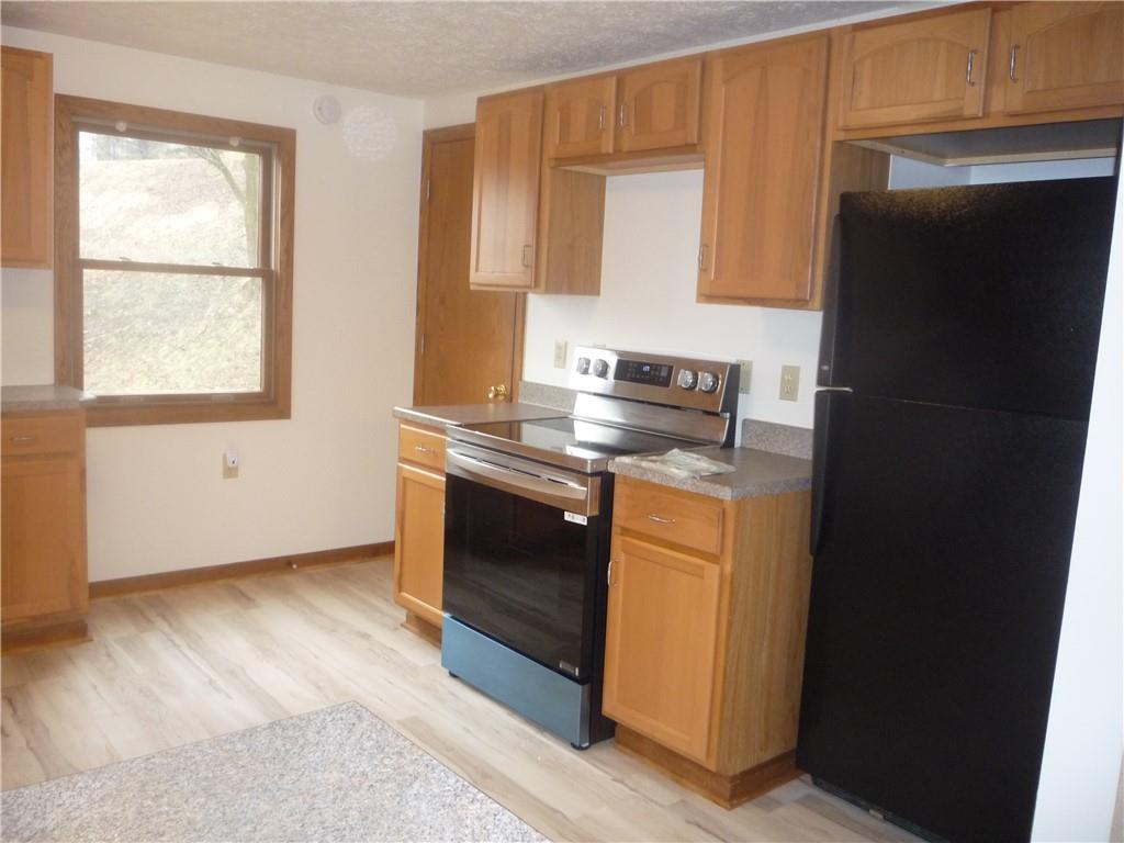 4465 Mt Troy Rd Extension, Unit 2 Pittsburgh, PA 15214 - Photo 10 of 36 a kitchen with stainless steel appliances granite countertop a refrigerator and a stove