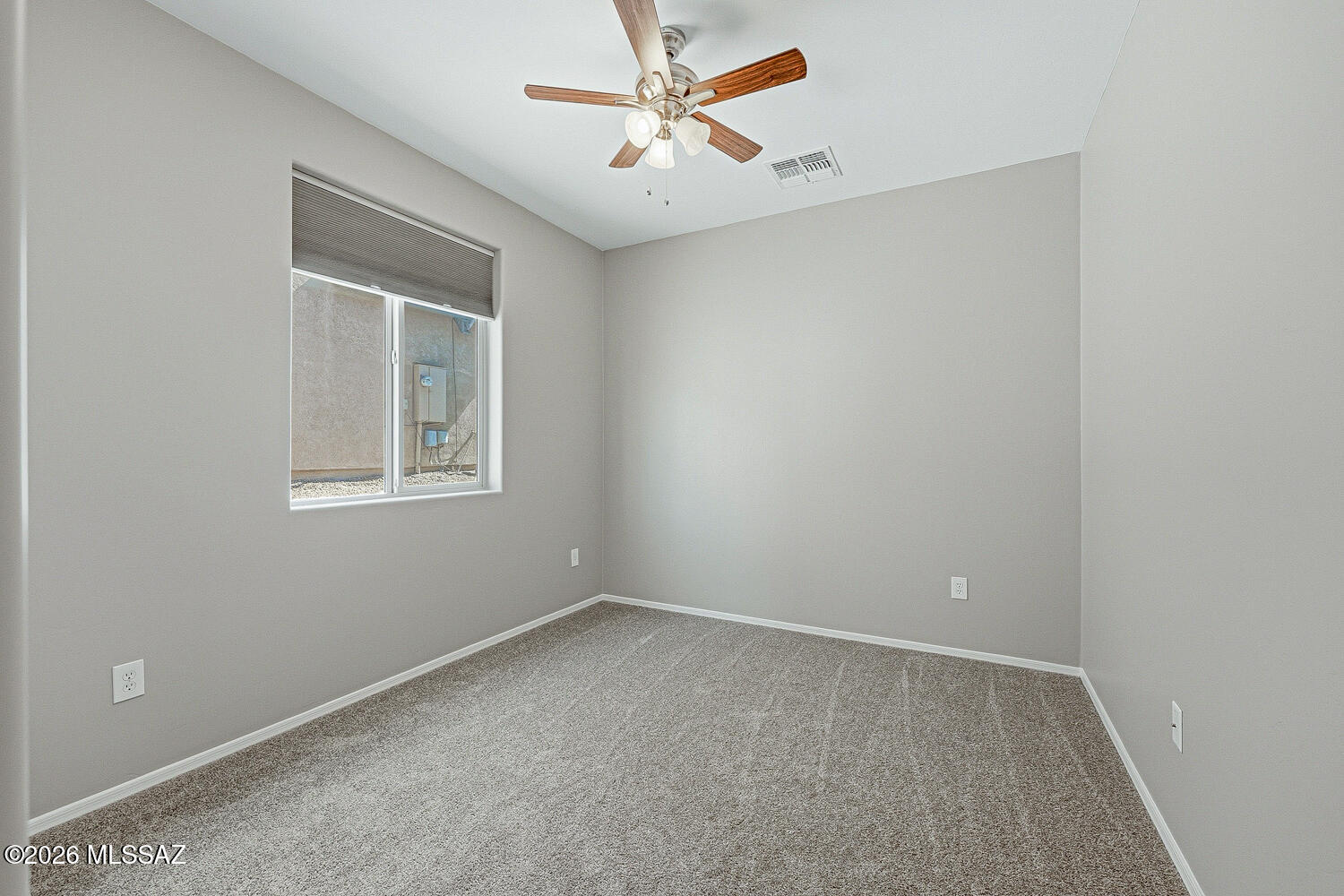 323 East Refuge Loop Vail, AZ 85641 - Photo 16 of 51 an empty room with a window and a fan
