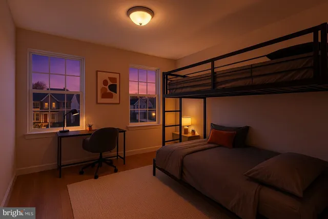 a bedroom with a bed a desk and chair with the potted plant