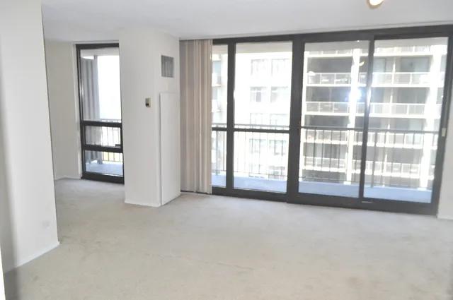 a view of an empty room with a window