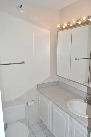 a bathroom with a sink and vanity