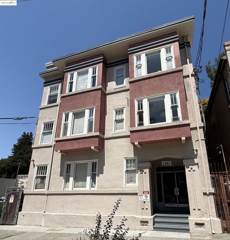 a view of a kitchen with wooden floor and a window