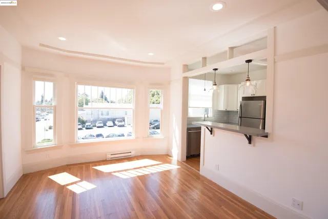 a kitchen with stainless steel appliances and white cabinets
