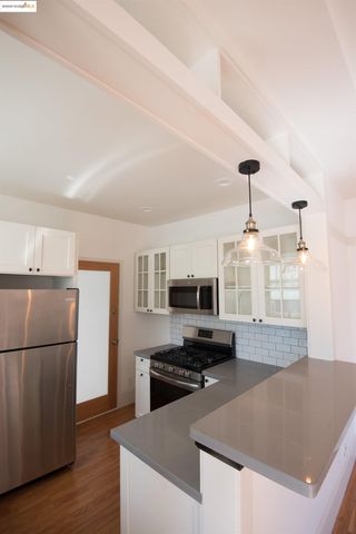 a kitchen with a stove and a microwave