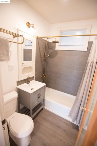 a kitchen with a refrigerator and a stove