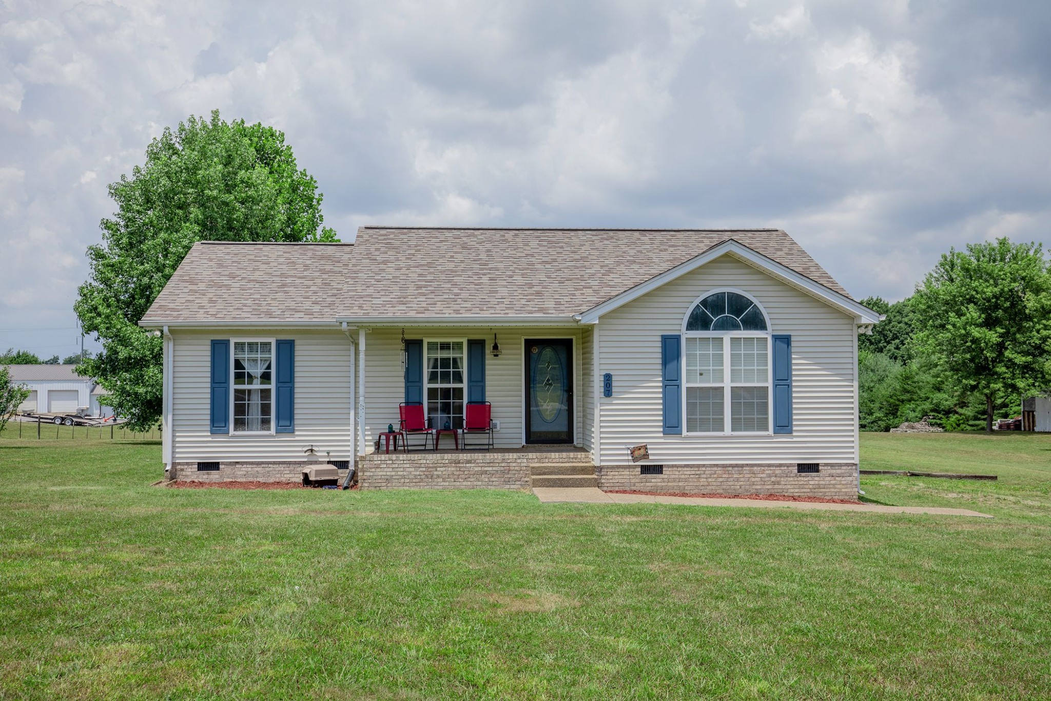 207 Hester Road Portland, TN 37148 - Photo 1 of 41 a front view of a house with a yard