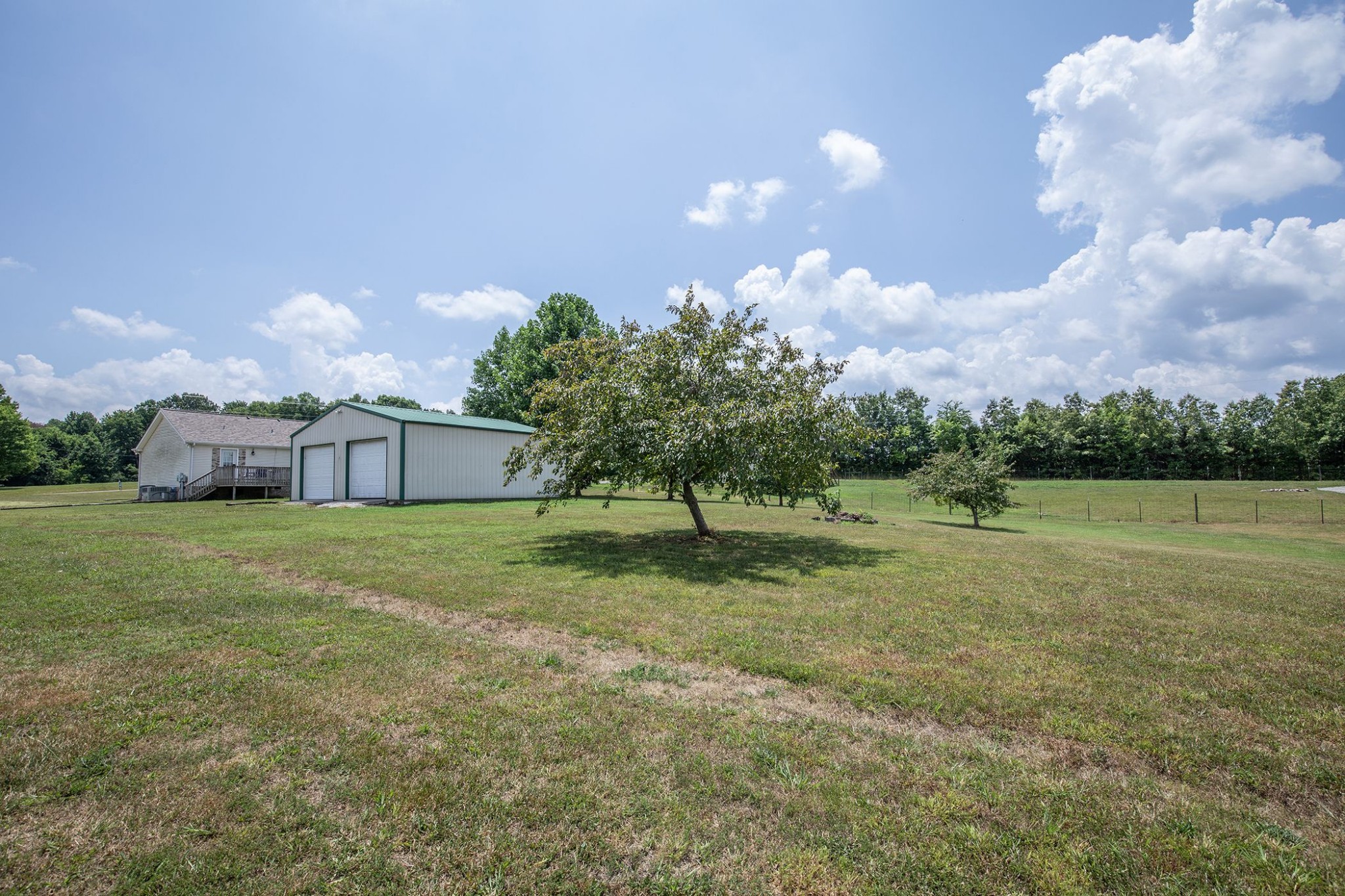 207 Hester Road Portland, TN 37148 - Photo 18 of 41 a view of a big yard with a house