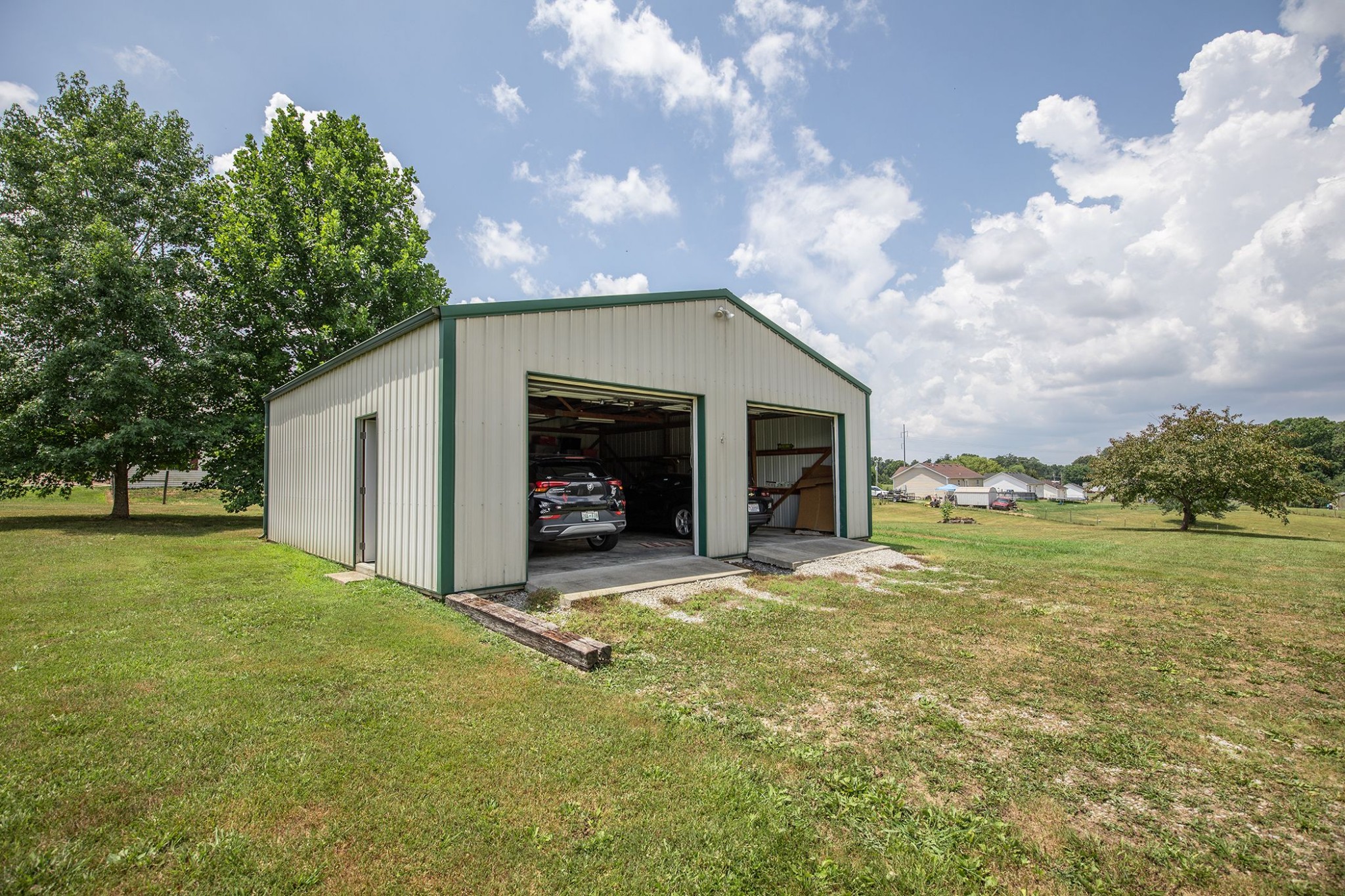 207 Hester Road Portland, TN 37148 - Photo 22 of 41 a view of a house with a yard and garage