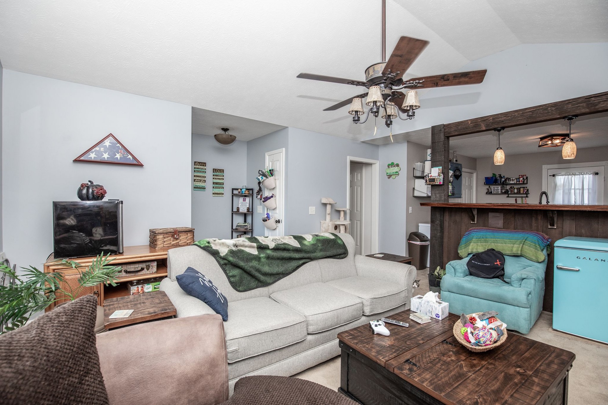 207 Hester Road Portland, TN 37148 - Photo 26 of 41 a living room with furniture and a dining table with wooden floor