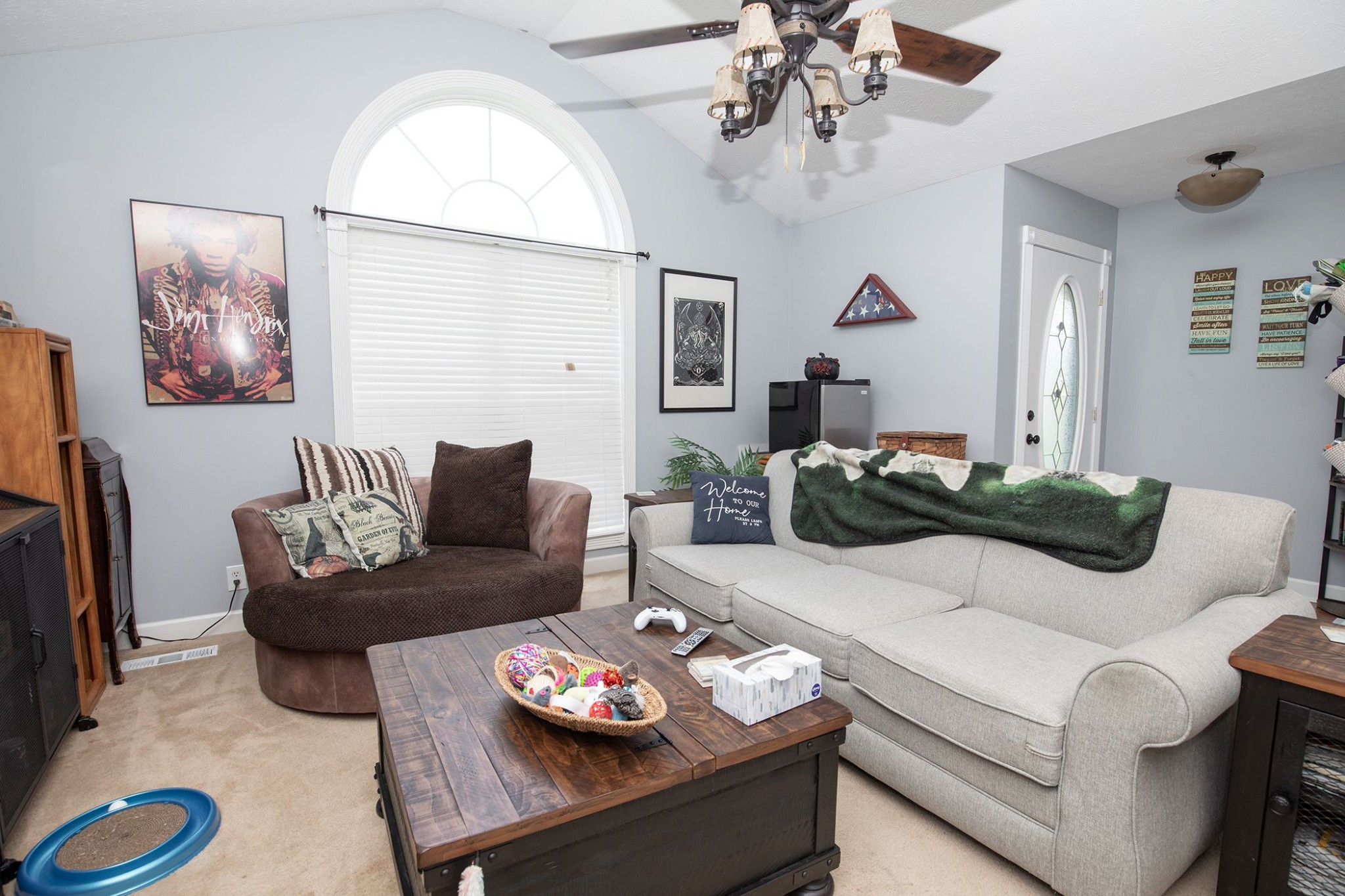 207 Hester Road Portland, TN 37148 - Photo 27 of 41 a living room with furniture and a chandelier