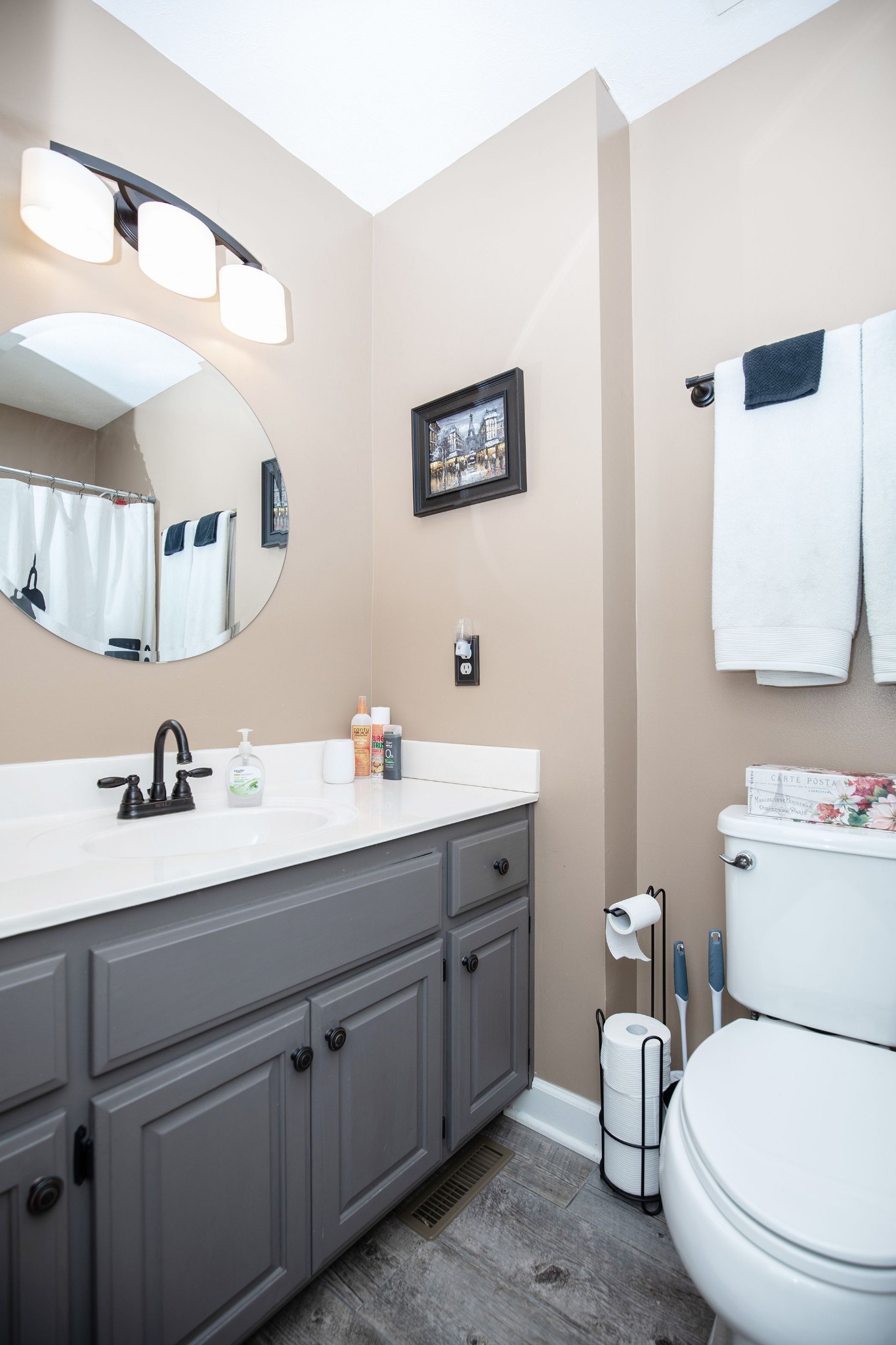 207 Hester Road Portland, TN 37148 - Photo 34 of 41 a bathroom with a toilet a sink a mirror and vanity